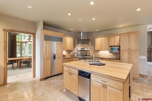 435 Red Rock Rd, Durango, CO 81301 - kitchen featuring paneled fridge, wall chimney range hood, stainless steel microwave, light brown cabinets, and recessed lighting