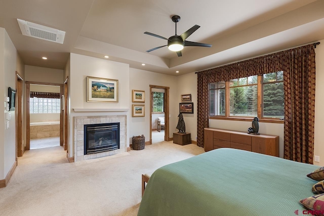 435 Red Rock Rd, Durango, CO 81301 - bedroom with light colored carpet, a fireplace, recessed lighting, connected bathroom, and a ceiling fan