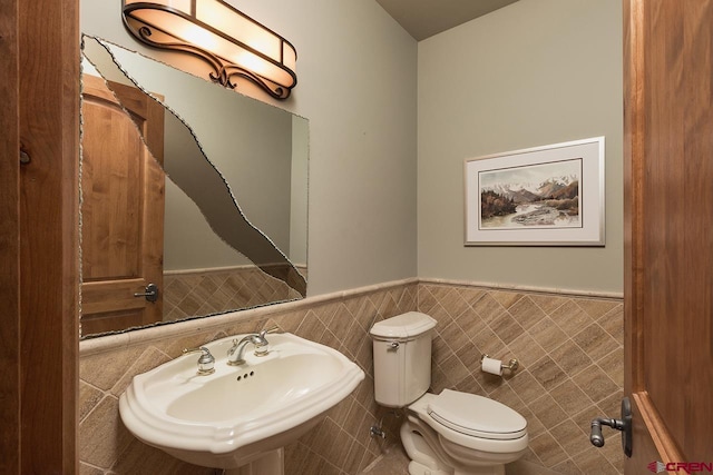 435 Red Rock Rd, Durango, CO 81301 - half bath with a wainscoted wall and tile walls