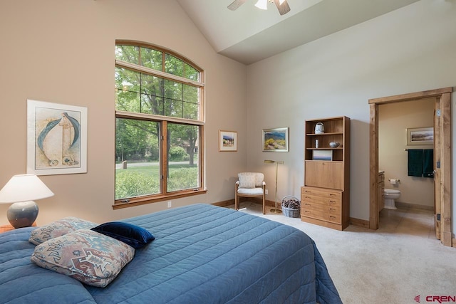 435 Red Rock Rd, Durango, CO 81301 - bedroom featuring high vaulted ceiling, light carpet, multiple windows, ensuite bath, and a ceiling fan