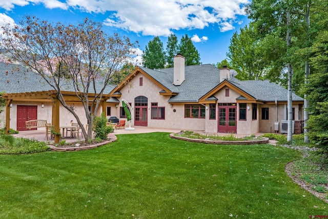 435 Red Rock Rd, Durango, CO 81301 - rear view of property with french doors, a patio, a chimney, stucco siding, and a lawn