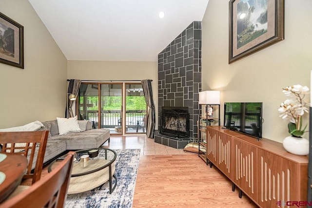 166 Yankee Girl Ct Unit 313, Durango, CO 81301 - living area featuring light wood-type flooring, a tiled fireplace, and recessed lighting