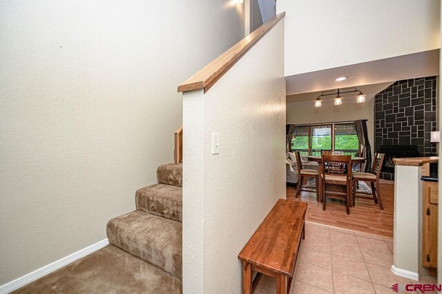 166 Yankee Girl Ct Unit 313, Durango, CO 81301 - stairs featuring tile patterned flooring and a textured wall