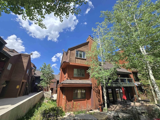166 Yankee Girl Ct Unit 313, Durango, CO 81301 - rear view of property with covered porch and a chimney
