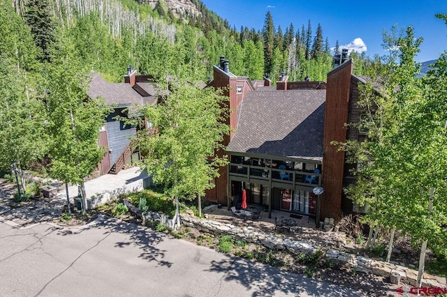 166 Yankee Girl Ct Unit 313, Durango, CO 81301 - view of subject property with a heavily wooded area