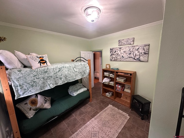 1250 Snowden St, Silverton, CO 81433 - bedroom with ornamental molding, a wood stove, and dark tile patterned floors