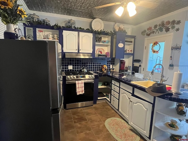 1250 Snowden St, Silverton, CO 81433 - kitchen with appliances with stainless steel finishes, open shelves, under cabinet range hood, dark countertops, and decorative backsplash
