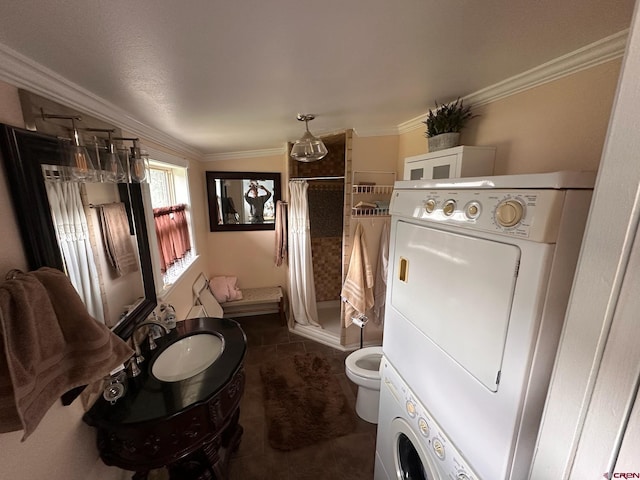 1250 Snowden St, Silverton, CO 81433 - full bath featuring a shower stall, ornamental molding, estacked washer and dryer, and tile patterned floors