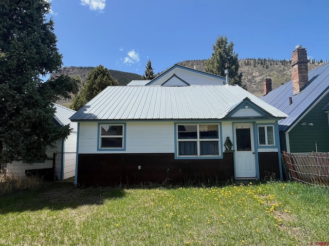1250 Snowden St, Silverton, CO 81433 - bungalow-style house featuring a metal roof, a chimney, and a mountain view