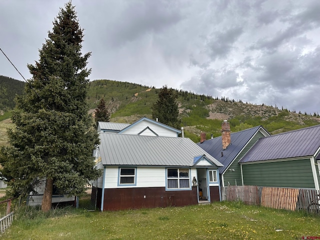 1250 Snowden St, Silverton, CO 81433 - view of front of house featuring a mountain view, a chimney, and a metal roof