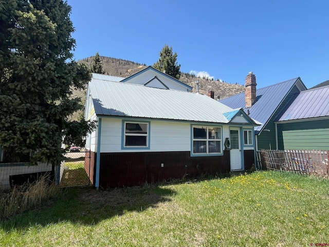 1250 Snowden St, Silverton, CO 81433 - rear view of property featuring a chimney and a metal roof