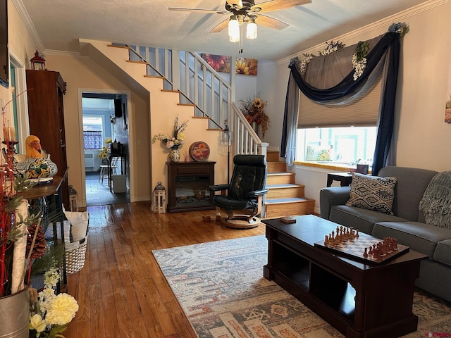 1250 Snowden St, Silverton, CO 81433 - living room with stairway, wood-type flooring, healthy amount of natural light, and ornamental molding