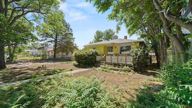 735 Teller Ave, Grand Junction, CO 81501 - view of front of house featuring a chimney and a wooden deck