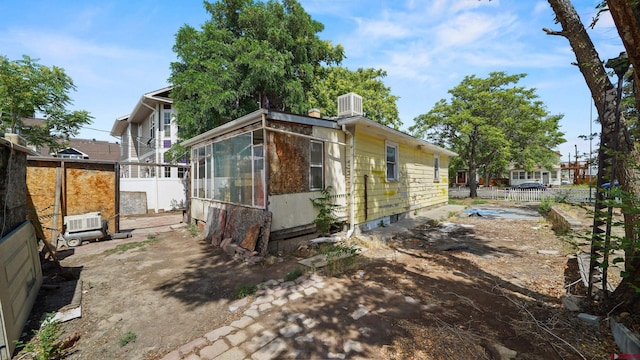 735 Teller Ave, Grand Junction, CO 81501 - view of side of home with a sunroom and a central AC unit