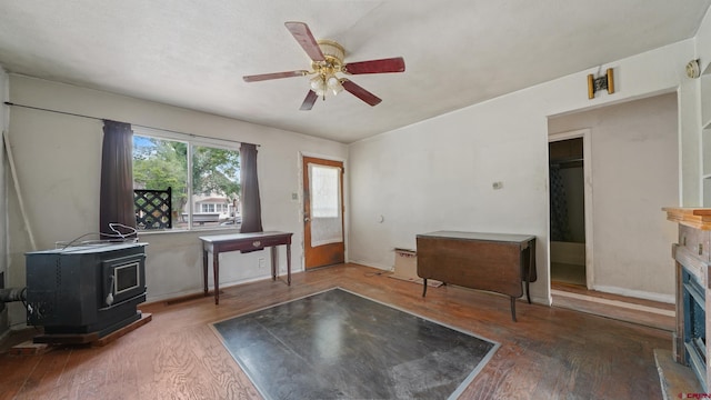 735 Teller Ave, Grand Junction, CO 81501 - interior space featuring a wood stove, wood-type flooring, ceiling fan, and a fireplace