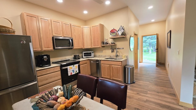 67 Gleneagles Dr, Durango, CO 81301 - kitchen featuring stainless steel appliances, light brown cabinetry, light wood-style floors, recessed lighting, and open shelves