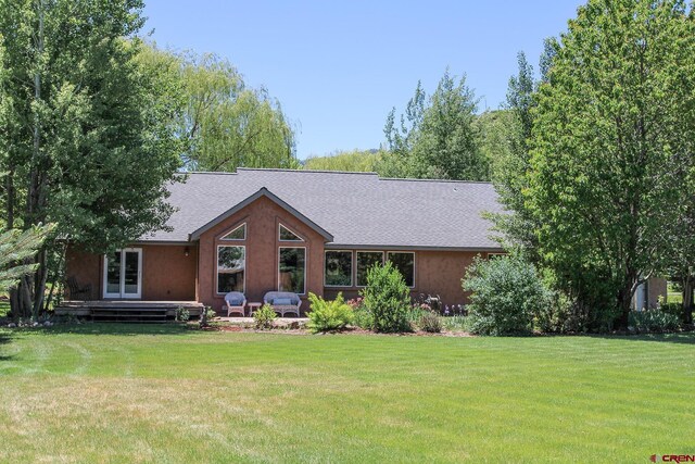 67 Gleneagles Dr, Durango, CO 81301 - back of property with a yard and a shingled roof