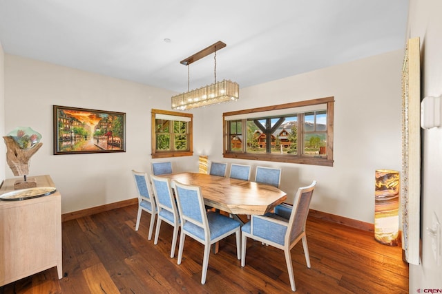 322 Wapiti Ln, Crested Butte, CO 81224 - dining room featuring baseboards and hardwood / wood-style flooring