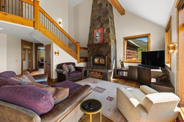 322 Wapiti Ln, Crested Butte, CO 81224 - living area with wood finished floors, high vaulted ceiling, beam ceiling, and a fireplace