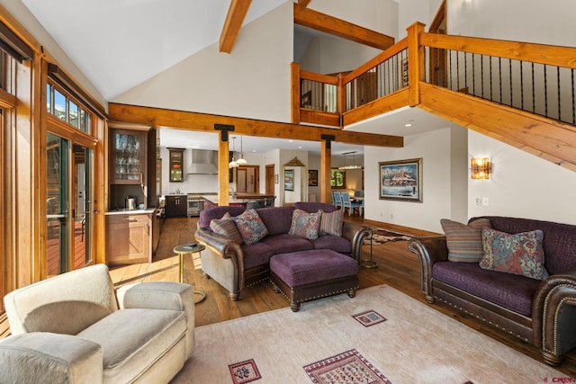 322 Wapiti Ln, Crested Butte, CO 81224 - living room with light wood finished floors, high vaulted ceiling, and beam ceiling