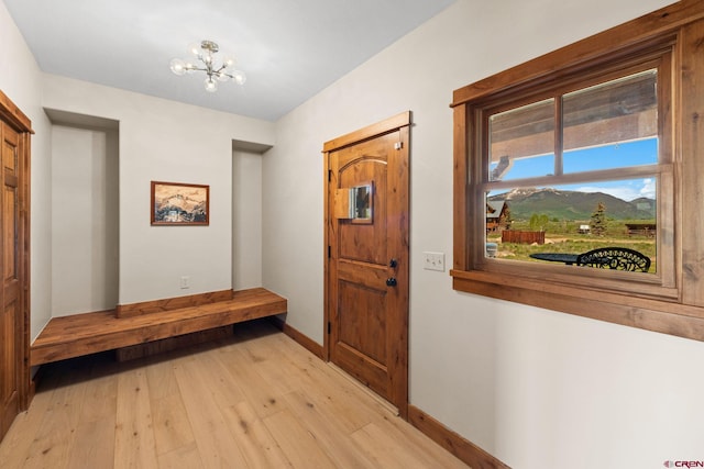 322 Wapiti Ln, Crested Butte, CO 81224 - foyer entrance with light wood finished floors and a chandelier