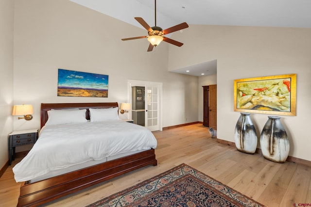 322 Wapiti Ln, Crested Butte, CO 81224 - bedroom with light wood finished floors, high vaulted ceiling, and a ceiling fan
