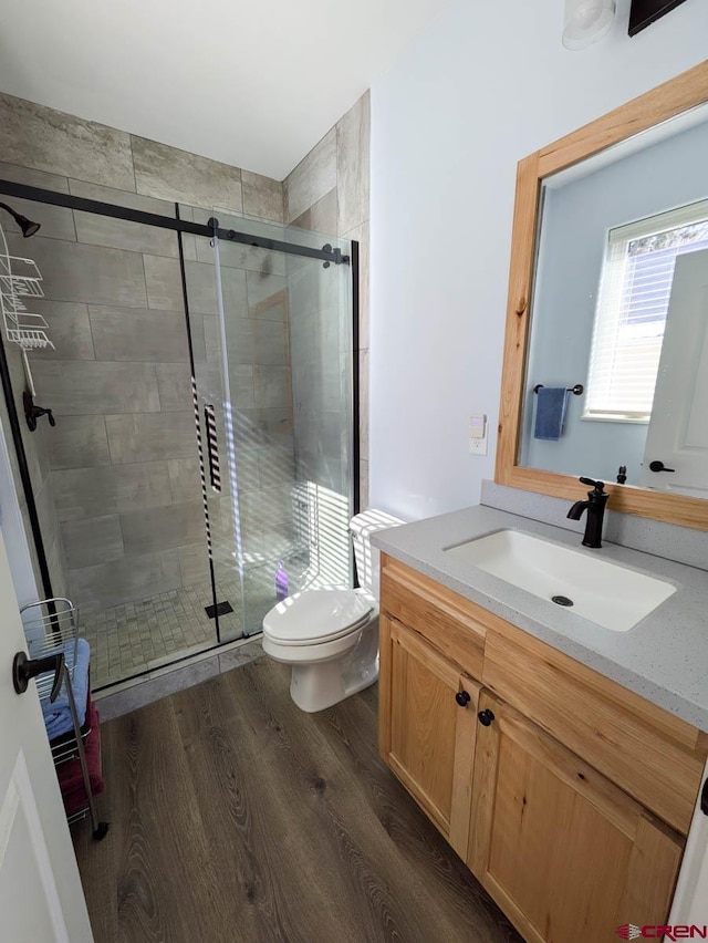 117 N Fork Ave, Paonia, CO 81428 - bathroom featuring vanity, a stall shower, and wood finished floors