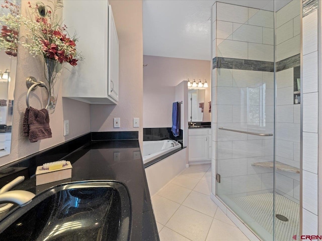 12689 6100th Rd, Montrose, CO 81401 - bathroom with a bath, tile patterned flooring, and a stall shower