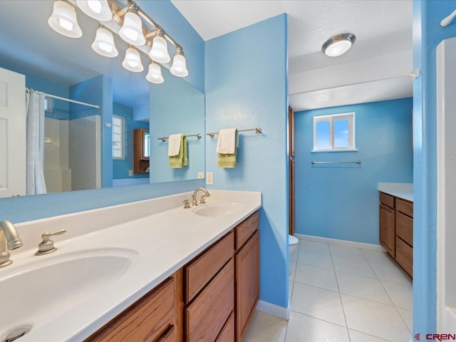 12689 6100th Rd, Montrose, CO 81401 - full bathroom with double vanity, tile patterned flooring, and a shower with shower curtain