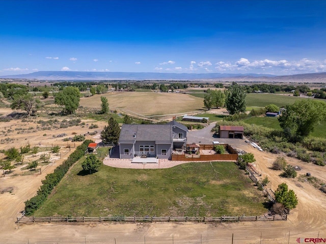 12689 6100th Rd, Montrose, CO 81401 - aerial view of sparsely populated area with a mountain backdrop