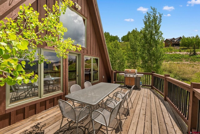 41 Cinnamon Mountain Rd, Mount Crested Butte, CO 81225 - wooden terrace featuring outdoor dining space and a grill