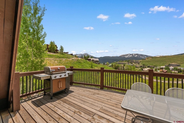 41 Cinnamon Mountain Rd, Mount Crested Butte, CO 81225 - wooden terrace with a grill and a mountain view