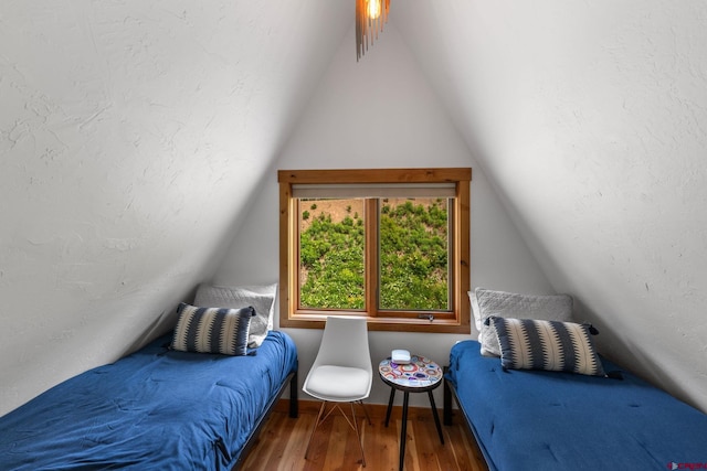 41 Cinnamon Mountain Rd, Mount Crested Butte, CO 81225 - bedroom with lofted ceiling and wood finished floors
