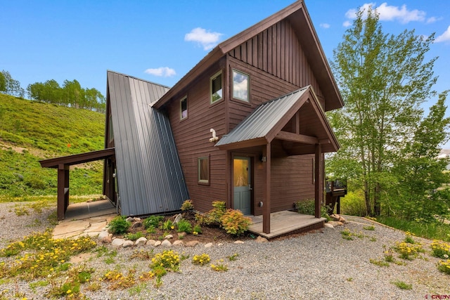41 Cinnamon Mountain Rd, Mount Crested Butte, CO 81225 - view of front of home featuring board and batten siding and a metal roof