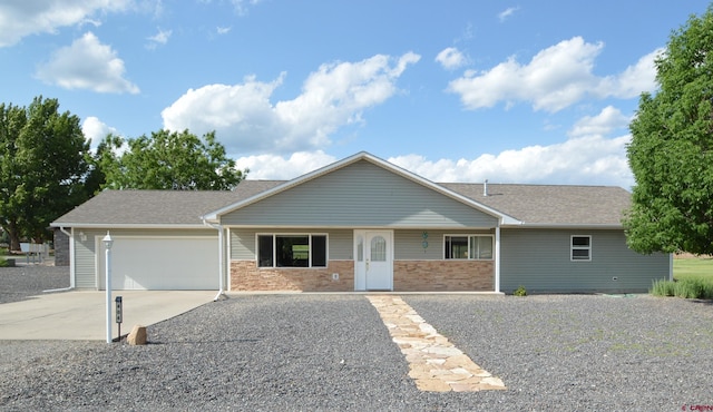 404 SE Birdie Cir, Cedaredge, CO 81413 - ranch-style house featuring concrete driveway, an attached garage, and a shingled roof