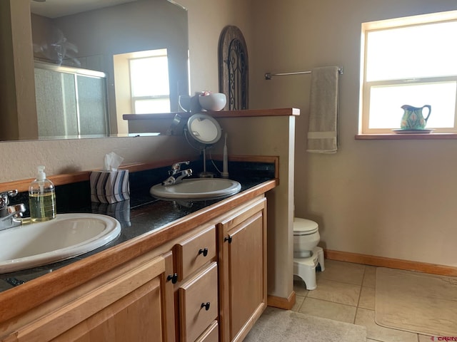 404 SE Birdie Cir, Cedaredge, CO 81413 - bathroom with a stall shower, double vanity, and tile patterned flooring