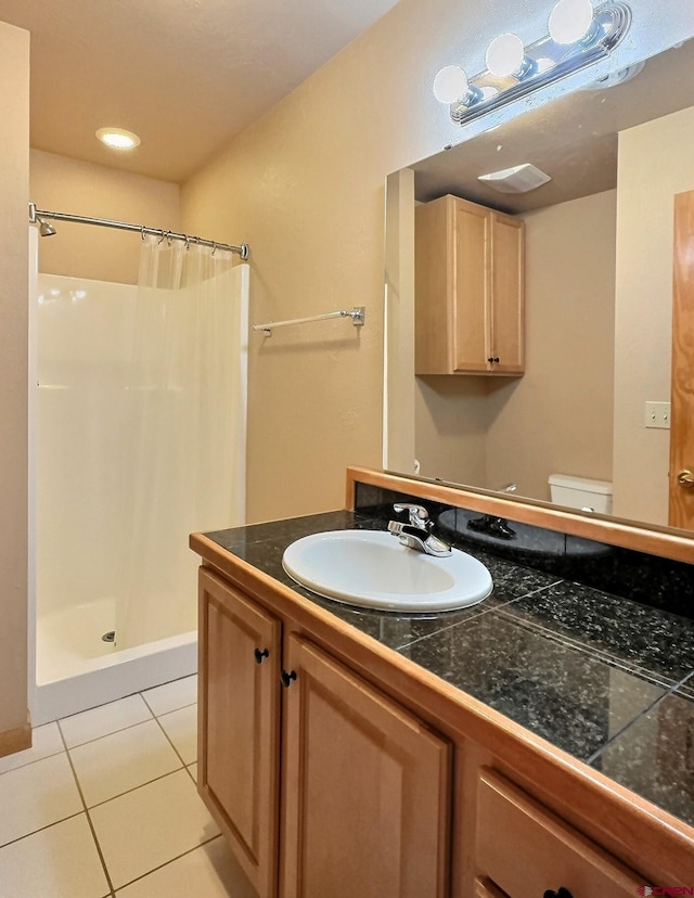 404 SE Birdie Cir, Cedaredge, CO 81413 - bathroom with a stall shower, tile patterned floors, and vanity
