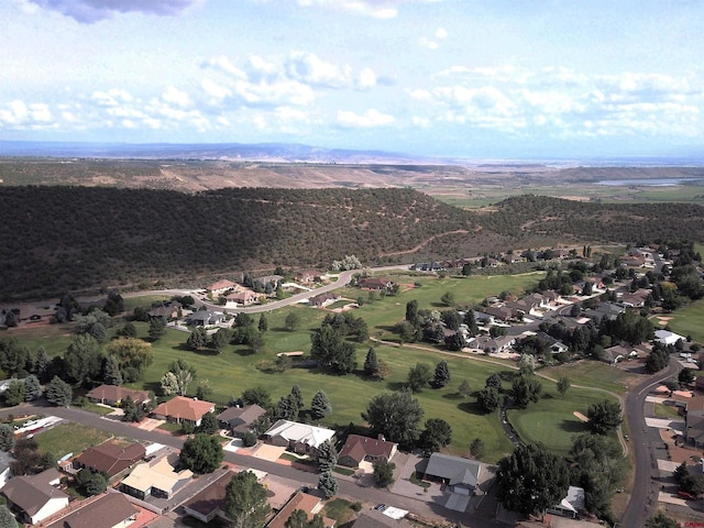 404 SE Birdie Cir, Cedaredge, CO 81413 - aerial view of property's location with nearby suburban area and a mountainous background