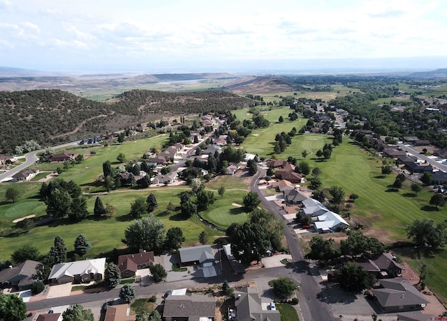 404 SE Birdie Cir, Cedaredge, CO 81413 - aerial view of property and surrounding area with a golf club, a mountainous background, and nearby suburban area