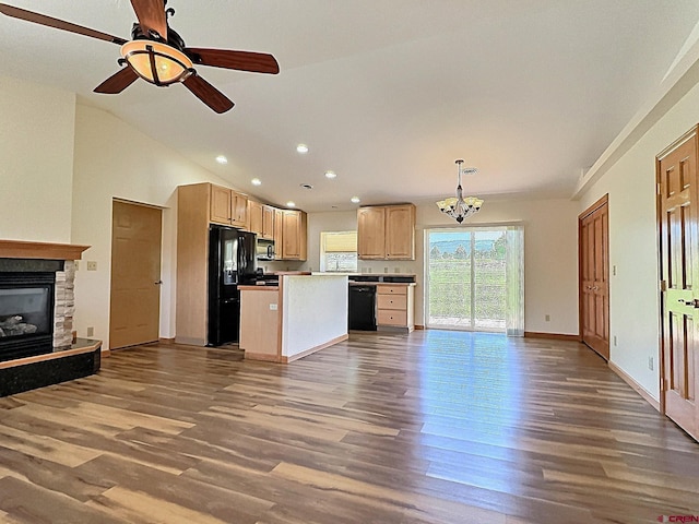 404 SE Birdie Cir, Cedaredge, CO 81413 - kitchen with open floor plan, black appliances, wood finished floors, vaulted ceiling, and recessed lighting