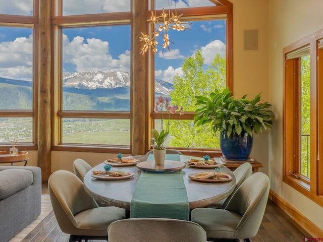 3 Summit Ct, Mount Crested Butte, CO 81225 - dining area featuring wood finished floors and a chandelier