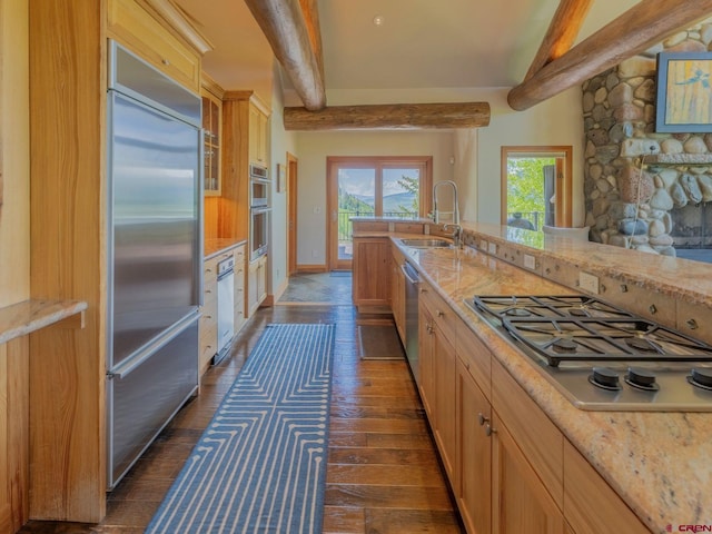 3 Summit Ct, Mount Crested Butte, CO 81225 - kitchen featuring stainless steel appliances, beam ceiling, dark wood-style floors, light stone counters, and glass insert cabinets