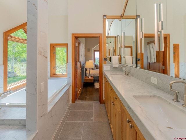 3 Summit Ct, Mount Crested Butte, CO 81225 - ensuite bathroom featuring healthy amount of natural light, double vanity, and a bath