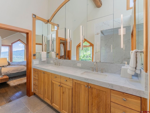 3 Summit Ct, Mount Crested Butte, CO 81225 - ensuite bathroom with double vanity, healthy amount of natural light, a marble finish shower, and wood finished floors
