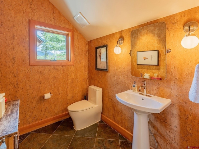 3 Summit Ct, Mount Crested Butte, CO 81225 - half bath featuring vaulted ceiling and tile patterned floors