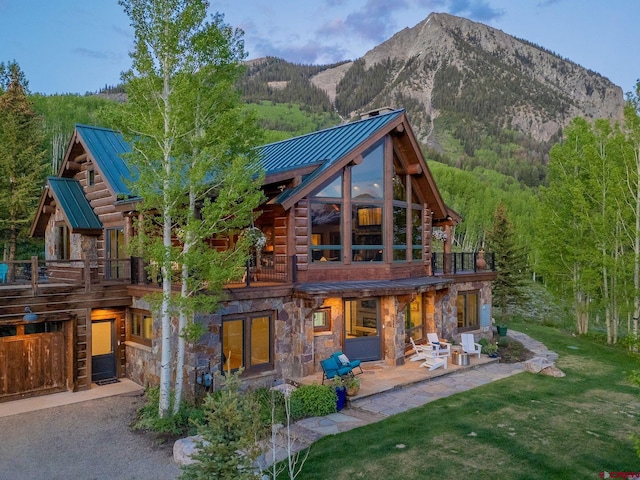 3 Summit Ct, Mount Crested Butte, CO 81225 - back of house featuring a balcony, a standing seam roof, and stone siding