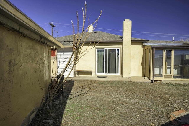 1132 Robinson Ave, Trinidad, CO 81082 - rear view of property with roof with shingles and a chimney