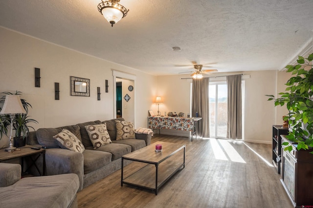 1132 Robinson Ave, Trinidad, CO 81082 - living area with wood finished floors, a textured ceiling, and ceiling fan