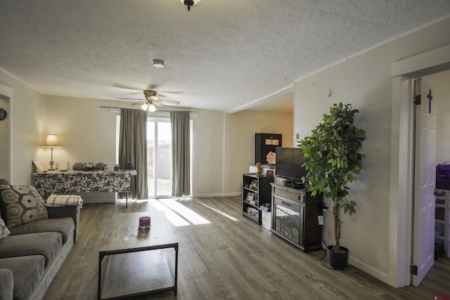 1132 Robinson Ave, Trinidad, CO 81082 - living room with wood finished floors, a textured ceiling, and ceiling fan