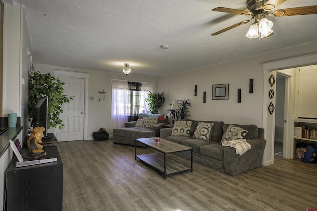 1132 Robinson Ave, Trinidad, CO 81082 - living area with wood finished floors, a textured ceiling, and a ceiling fan